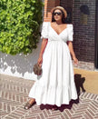 White puff-sleeve maxi dress with V-neck and ruffle hem