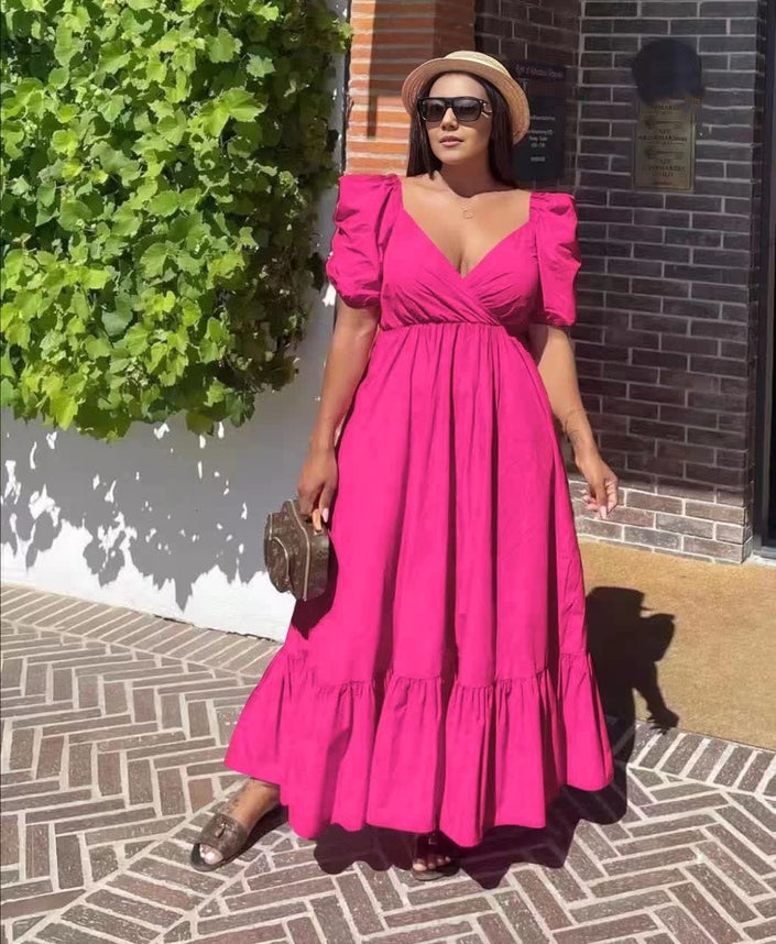 Magenta puff-sleeve maxi dress with V-neck and ruffle hem