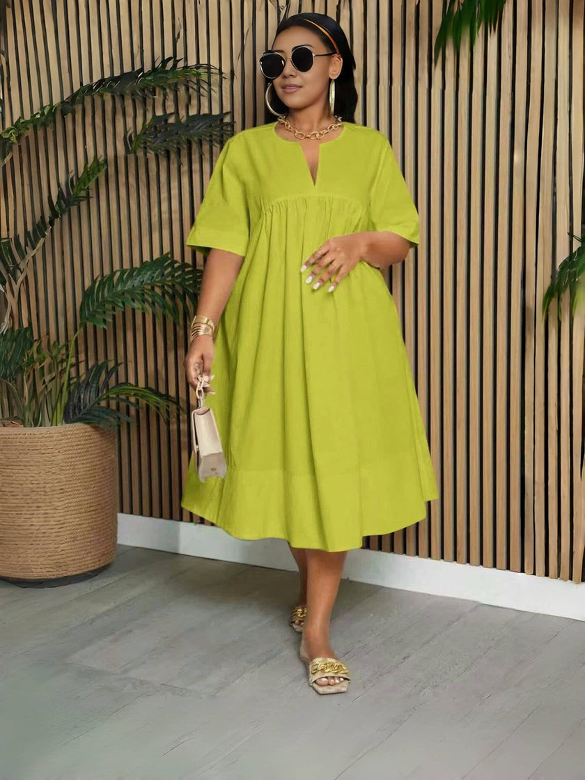 Lime green V-neck midi dress with short sleeves and gathered waist, loose fit