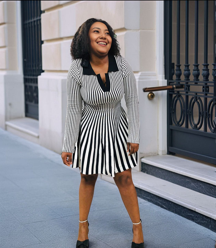 Black-and-white vertical stripe pleated knit mini dress, long sleeves, V-neck