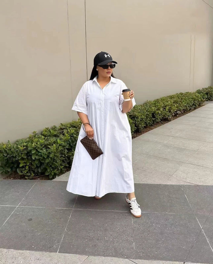White maxi shirt dress with short sleeves, button front, and pointed collar
