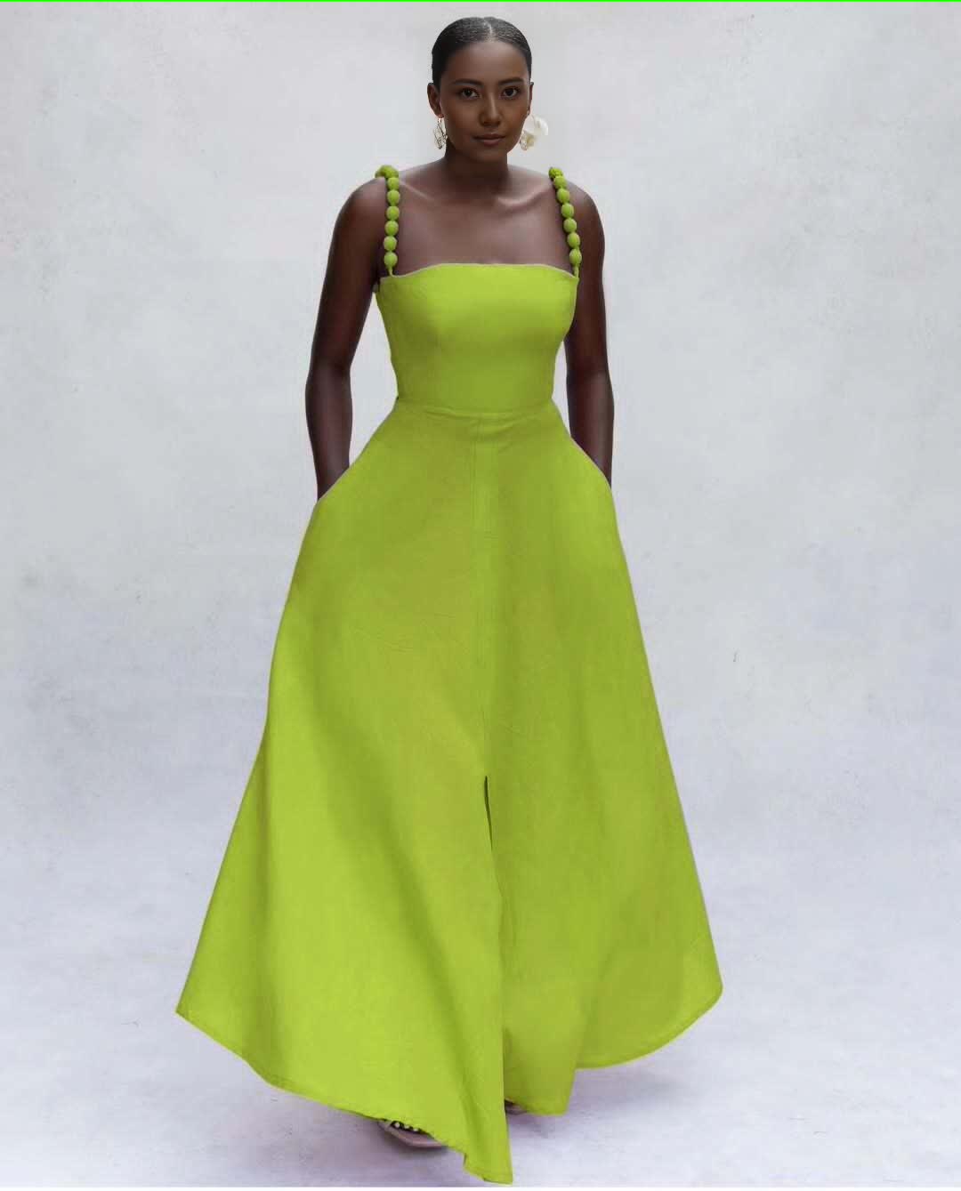 Lime green maxi dress with square neckline, pom-pom strap ties, flared skirt
