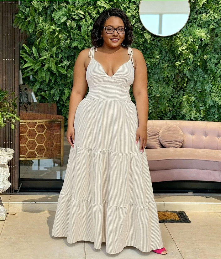 White tiered maxi dress with V-neck and thin tie shoulder straps