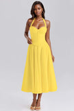 Yellow sleeveless A-line midi dress with bustier bodice and spaghetti straps