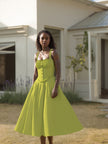 Lime green sleeveless A-line midi dress with gathered waist and thin straps