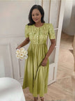 Yellow-green textured midi dress with puff sleeves, button front and A-line skirt
