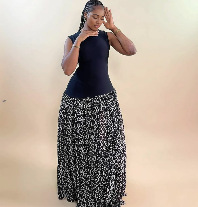 Sleeveless maxi dress with sleeveless dark bodice and black-and-white floral full skirt