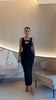 Black ribbed knit midi dress, sleeveless with scoop neckline and fitted shape