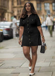 Black knitted mini dress with button front and patch pockets