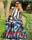 Printed maxi dress with wide flare skirt, black base, multicolor abstract pattern
