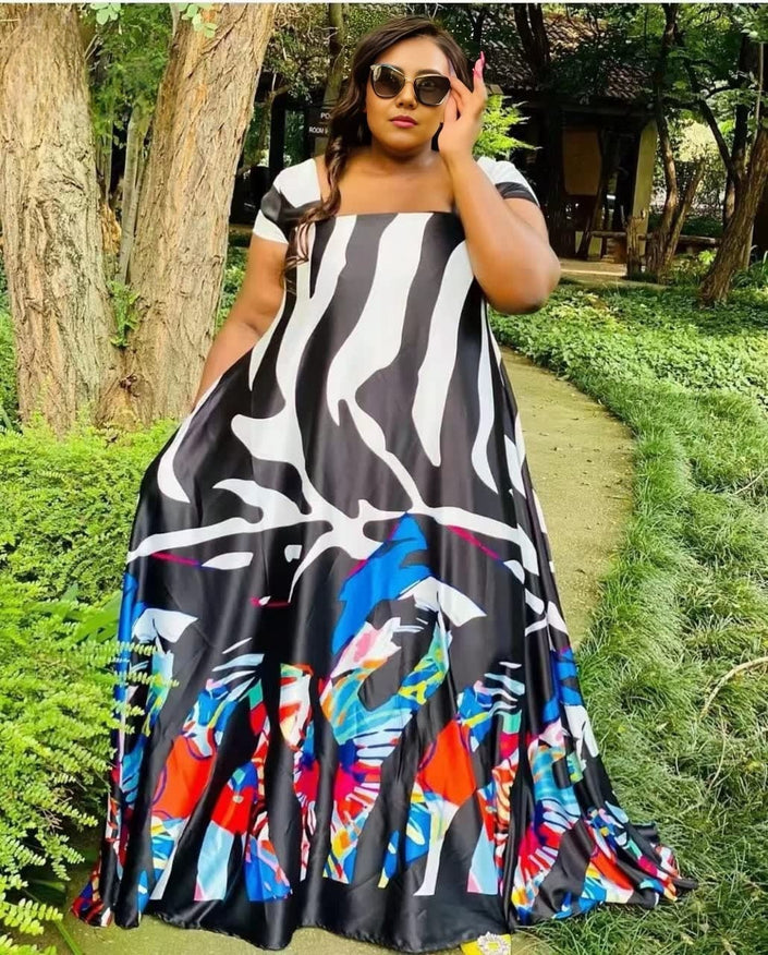 Printed maxi dress with wide flare skirt, black base, multicolor abstract pattern