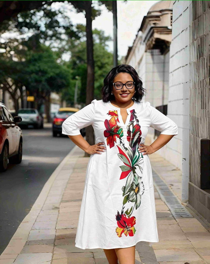 Plus size floral midi dress with V-neck, white with red and green print, short sleeves
