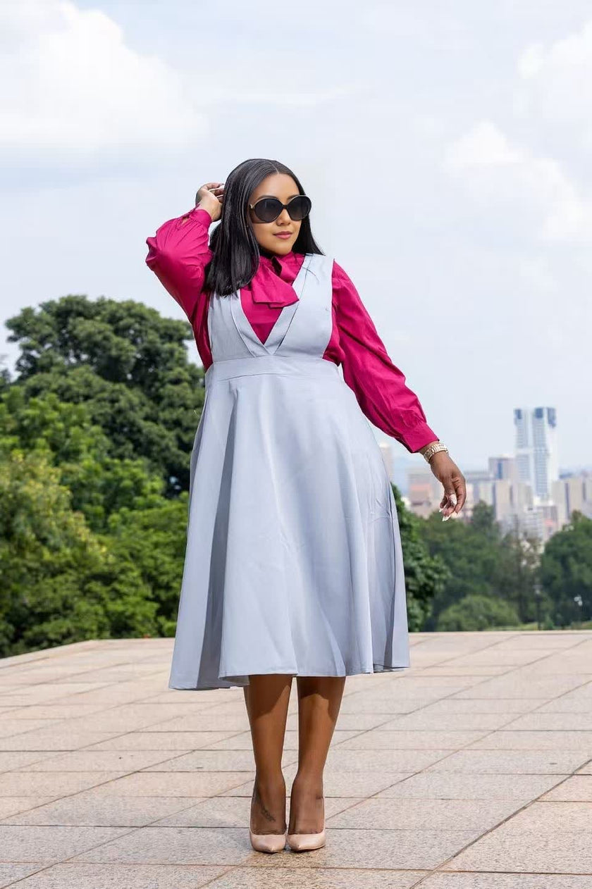 Light blue suspender midi dress with V-neck bodice and pleated skirt