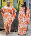 Floral batwing maxi dress in orange and white with side slit