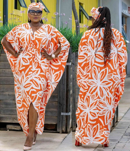 Floral batwing maxi dress in orange and white with side slit