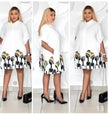 White abstract shirt dress with short sleeves and graphic hem print