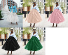 Layered tulle skirt, voluminous multi-layer look in white, pink, black, and green