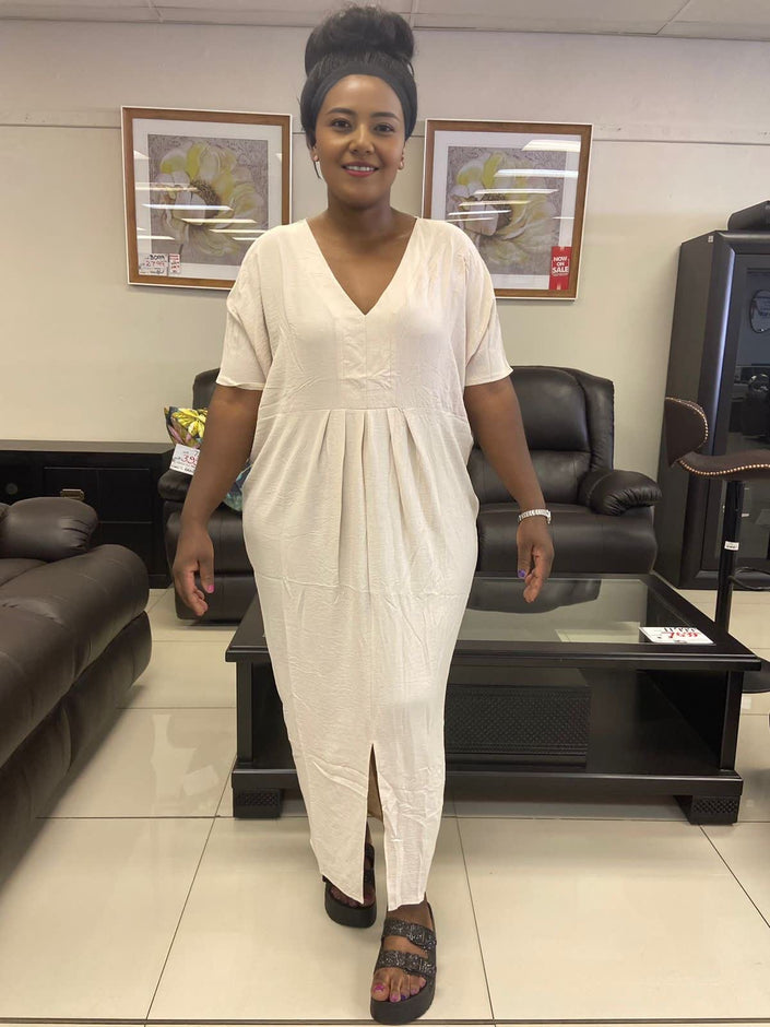 Ivory v-neck maxi dress with short sleeves, gathered waist and front slit