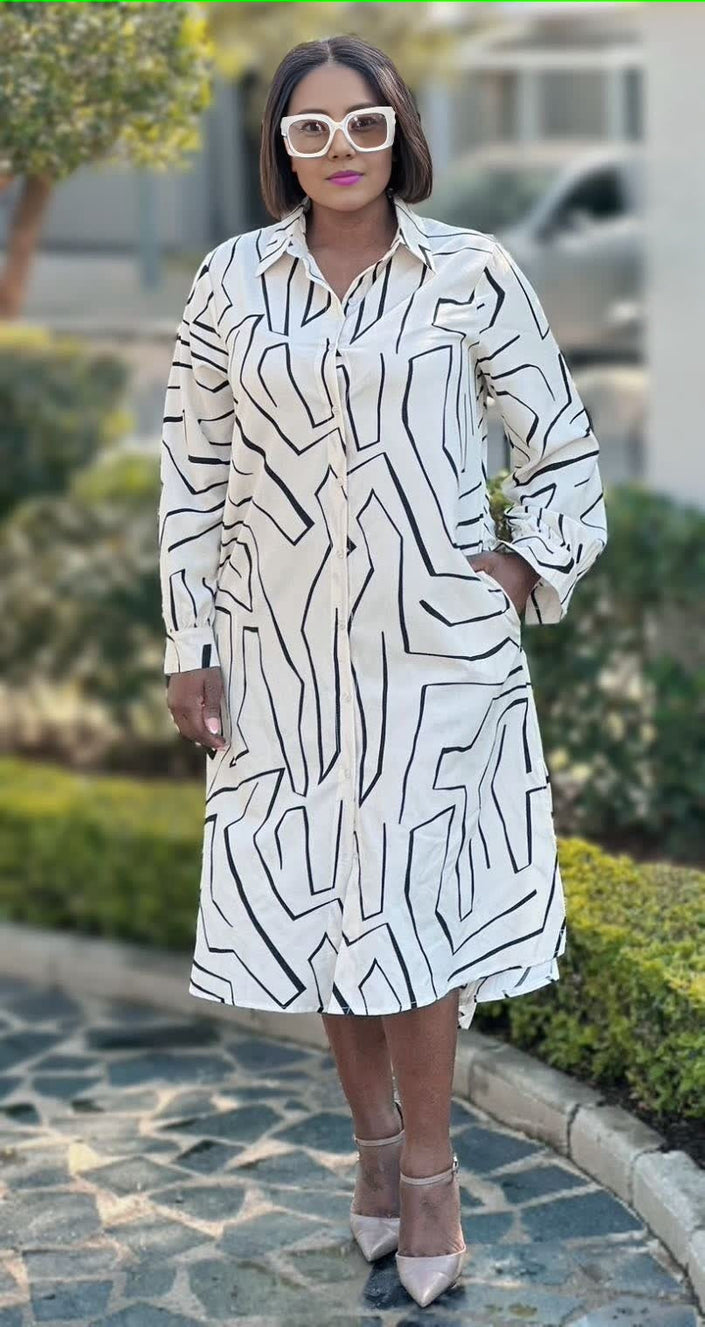 Geometric midi shirt dress, white with black lines, long sleeves, collared buttons