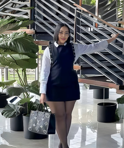 Black layered mini shirt dress with white button-up sleeves and front vest panel