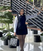 Layered mini shirt dress with white sleeves and dark bodice, V-neck