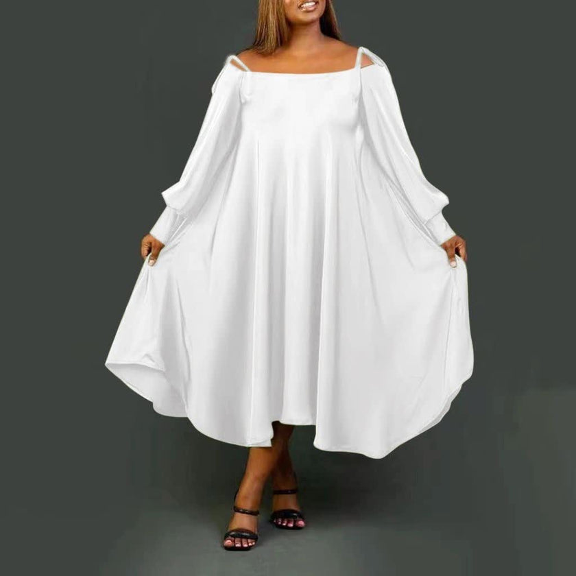 White maxi dress, loose fit, square neckline, batwing sleeves, side pockets.