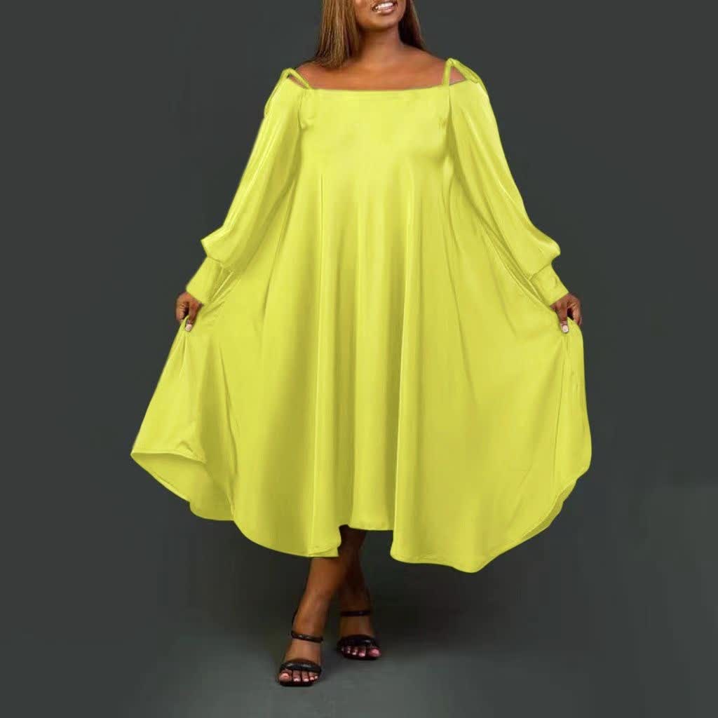 Yellow maxi dress with loose fit, square neckline, batwing sleeves, side pockets.