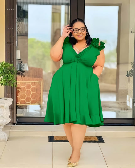 Green A-line midi dress with floral shoulder detail and V-neck