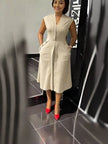 Beige sleeveless midi dress with V-neck, front button placket and waist seams
