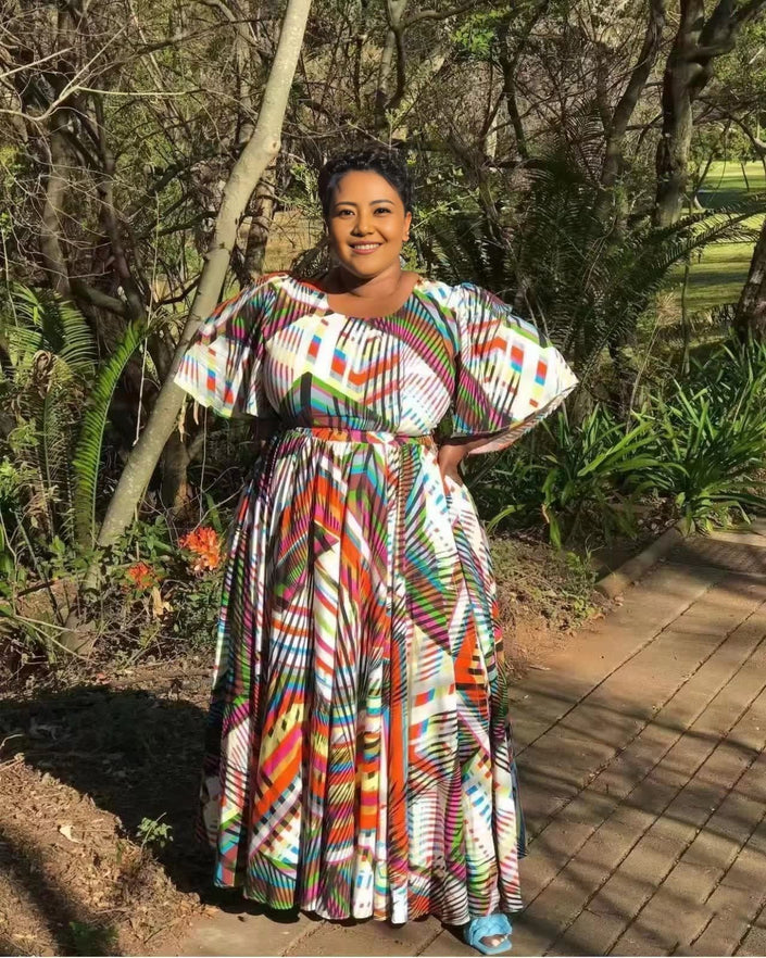 Plus size maxi dress with puff sleeves, multicolor geometric print, tiered skirt