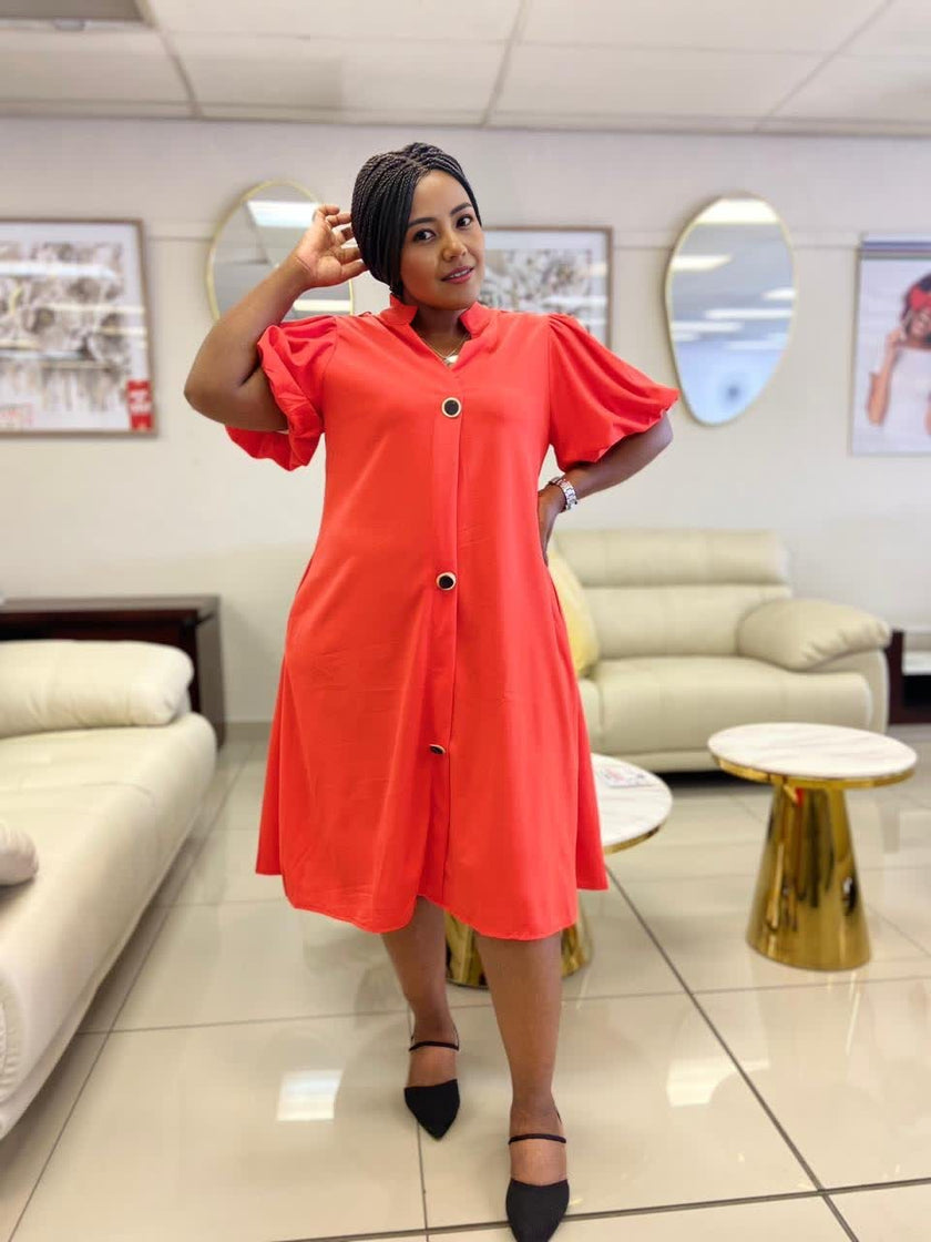 Orange-red puff-sleeve midi button dress with loose fit and front buttons.