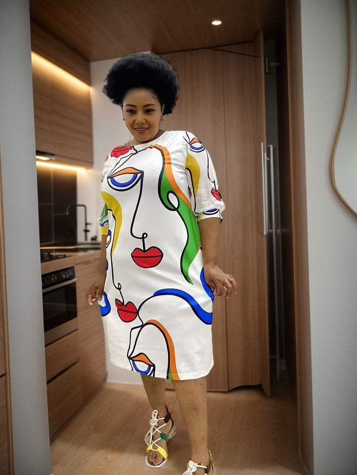 Plus size abstract print midi dress, white with multicolor face-style graphic, 3/4 sleeves