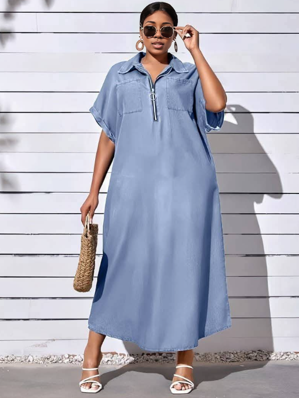 Light-blue shirt dress with zip front, chest pockets, and short sleeves