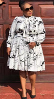 Ruffle midi dress in white with black abstract print, tiered skirt, long sleeves