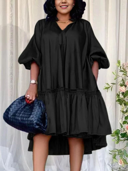 Ruffle hem party dress in black with loose gathered skirt and cinched waist