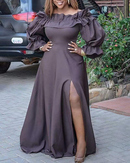 Dark gray maxi dress with ruffled neckline, puff sleeves, and side slit