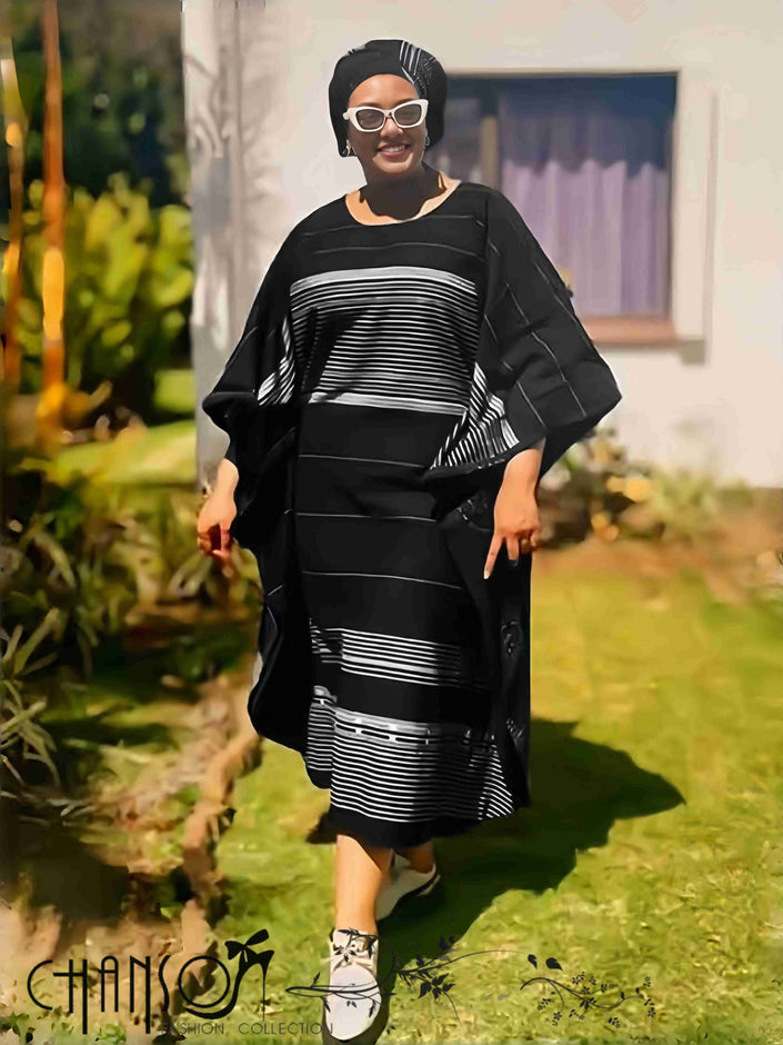 Black striped maxi dress with wide sleeves and tied waist, horizontal stripe pattern