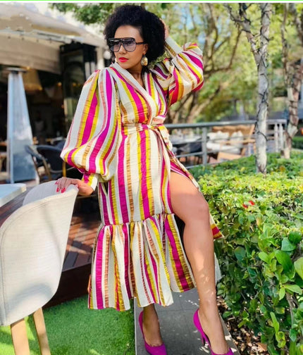 Plus size striped puff-sleeve dress with belted waist and tiered skirt