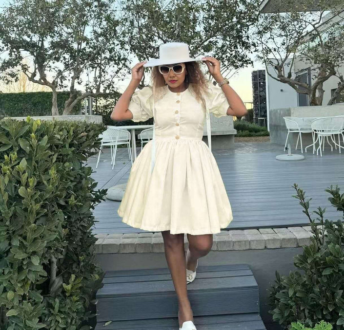 Beige puff sleeve dress with button front and flared skirt