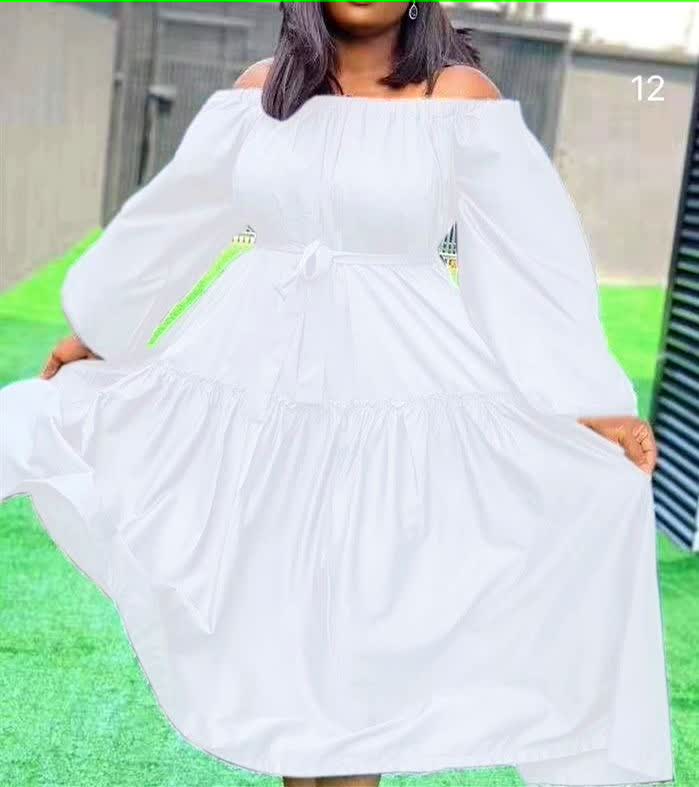 White off-shoulder maxi dress with long puff sleeves and ruffle hem tiers