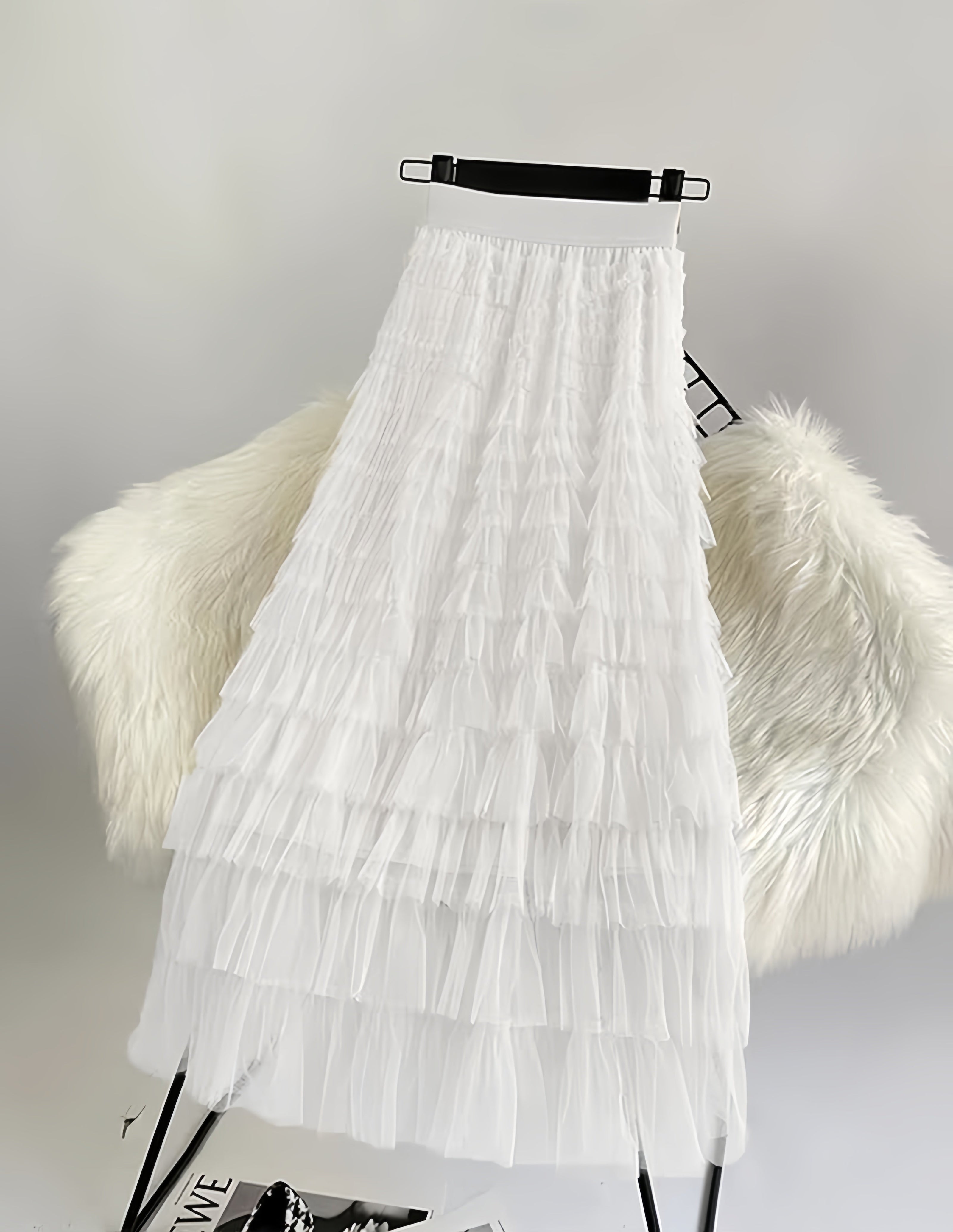 White layered pleated midi skirt with ruffle tiers and elastic waistband