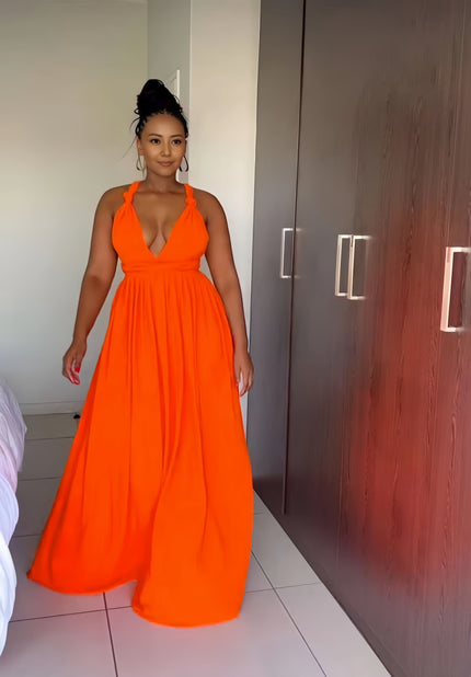 Orange halter maxi dress with plunging V neckline and flowing gathered skirt