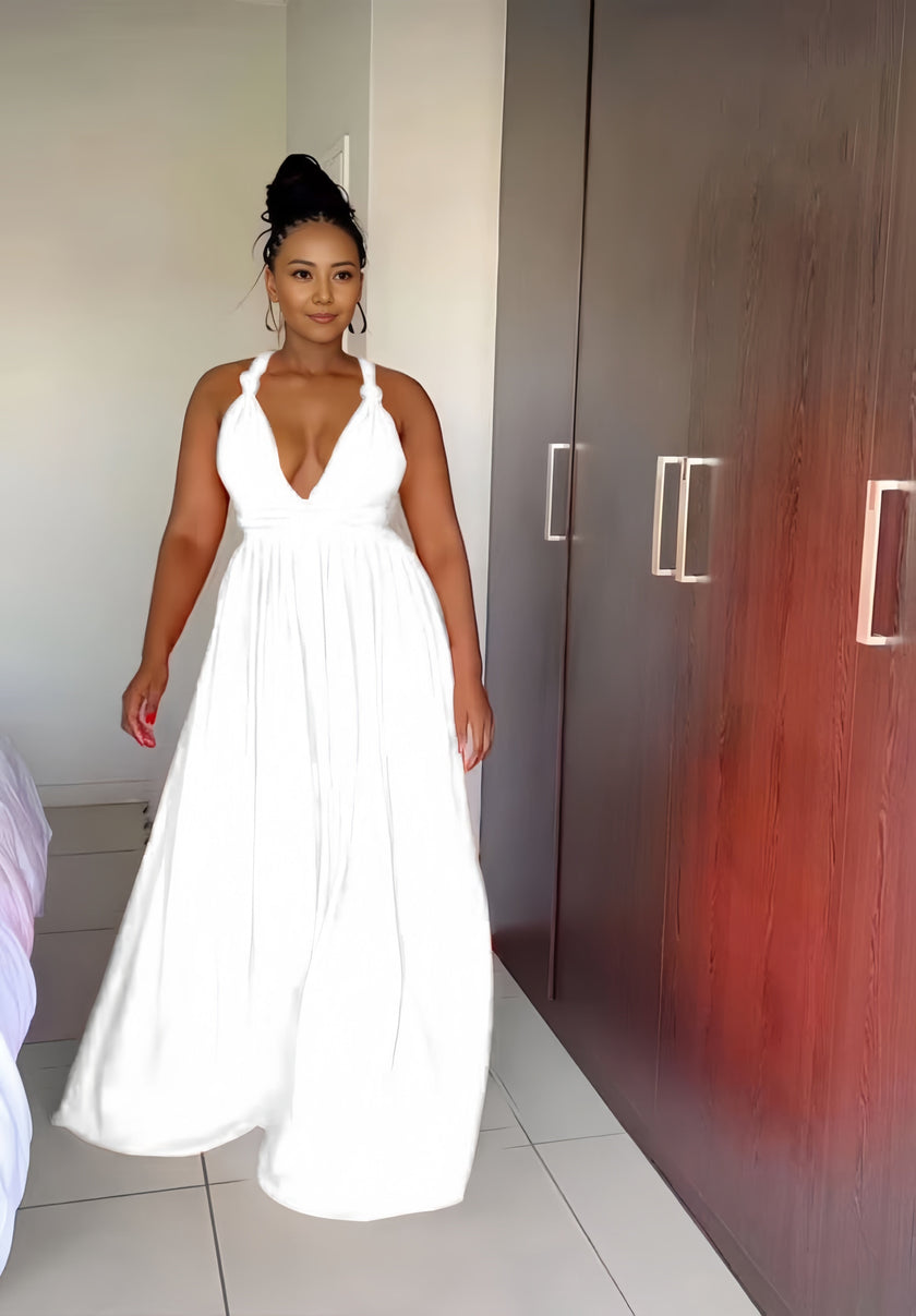 White halter maxi dress with plunging V neckline and gathered skirt
