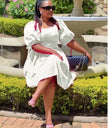 White puff sleeve A-line dress with ruched bodice and gathered skirt