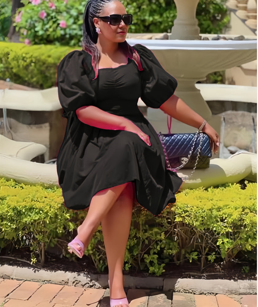 Black puff sleeve A-line dress with ruched bodice and gathered skirt