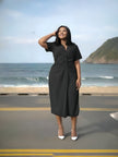 Black midi dress with V-neck, short sleeves, ruched waist front