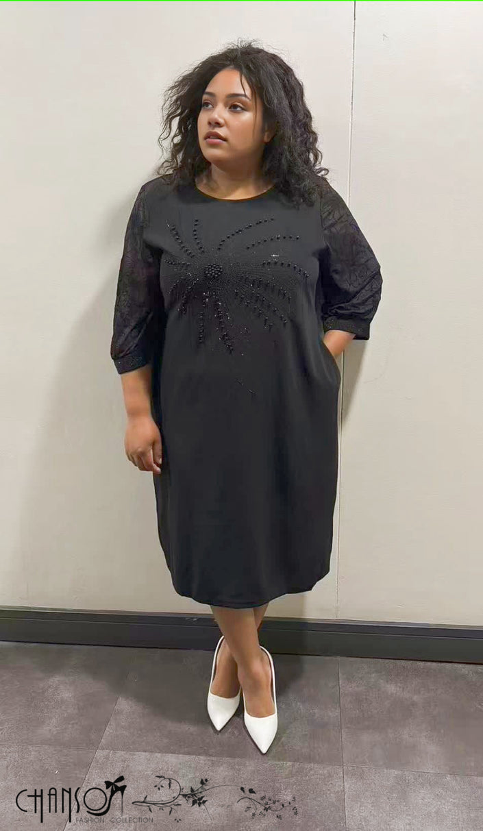 Black midi dress with 3/4 sleeves and beaded floral detail at the chest