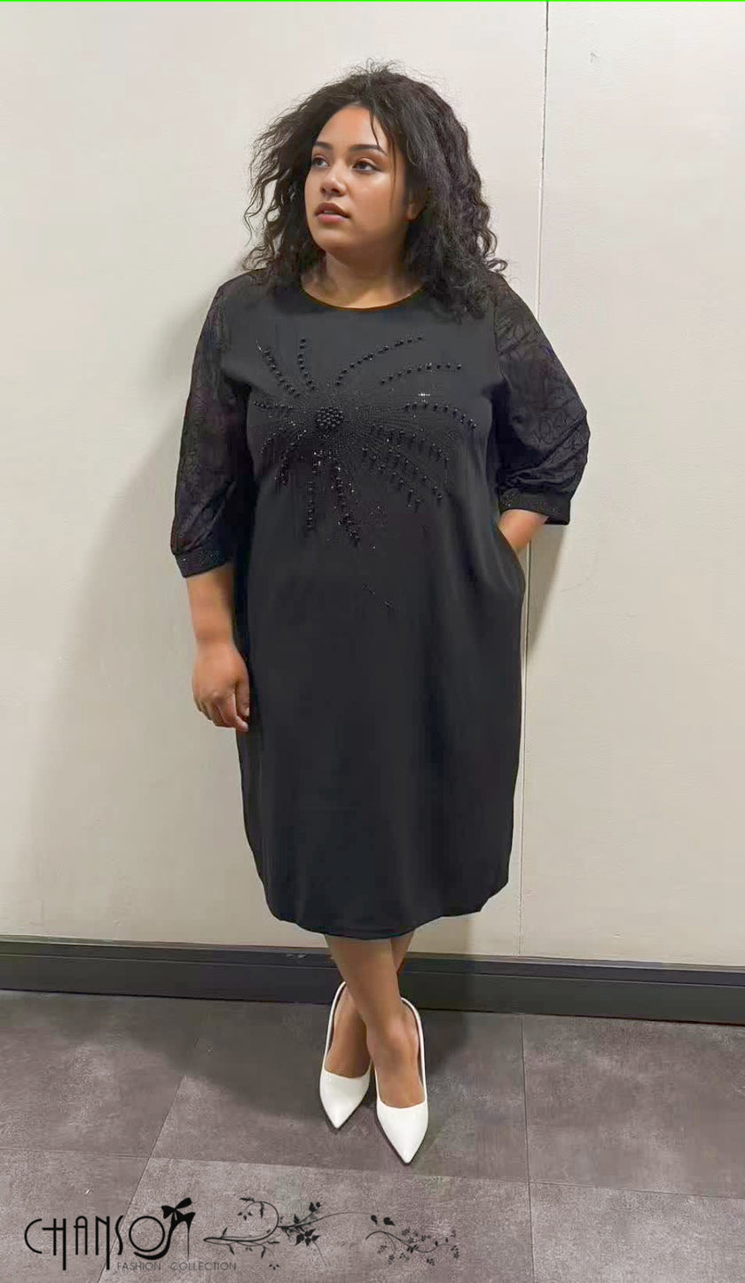 Black midi dress with 3/4 sleeves and beaded floral detail at the chest
