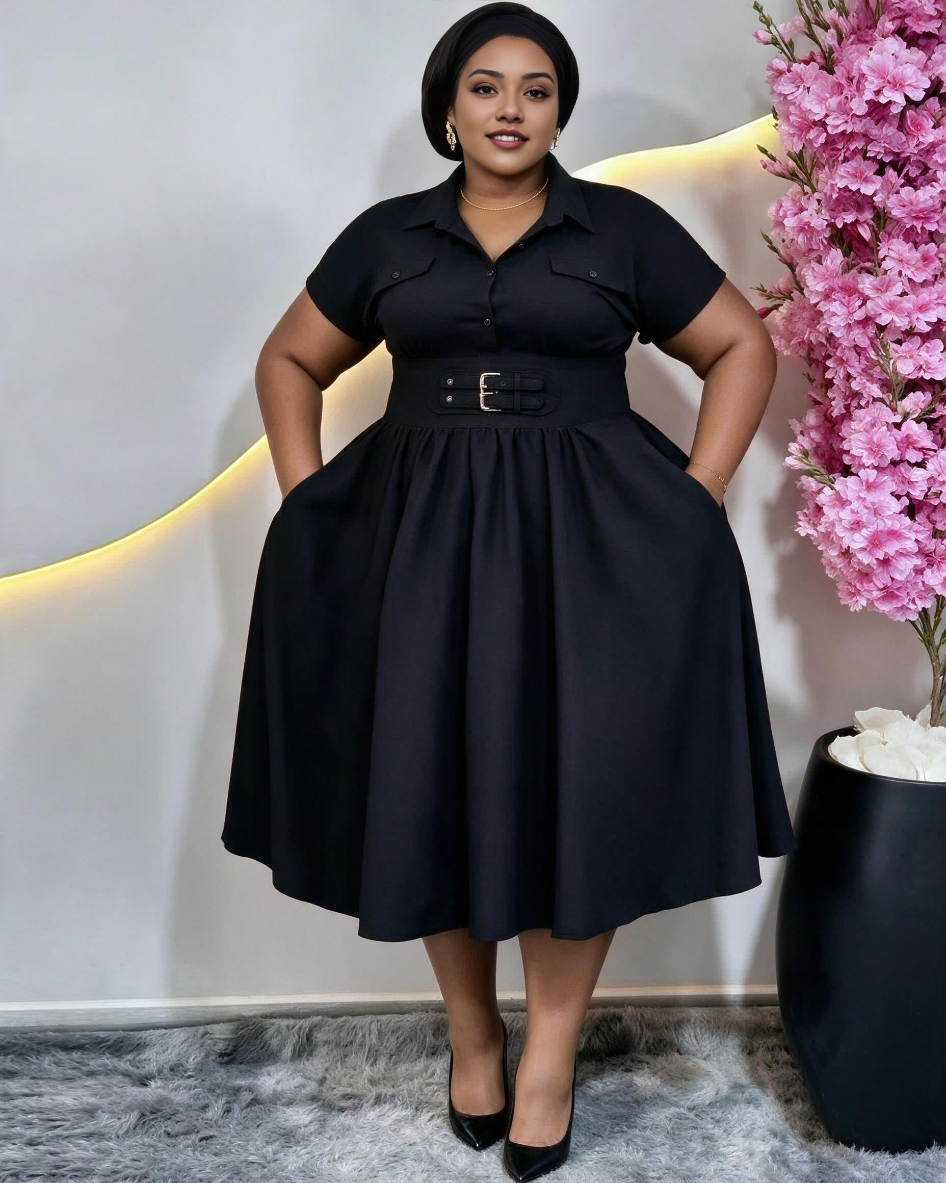 Plus-size black collared midi dress with short sleeves, buckle belt, and pockets