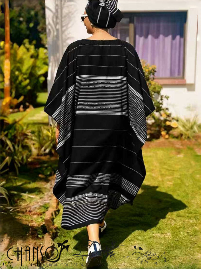 Back view black striped maxi dress with wide sleeves and horizontal stripe design